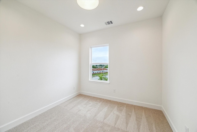 306 Felt Cir, Houston, TX 77011 - unfurnished room with light carpet and recessed lighting