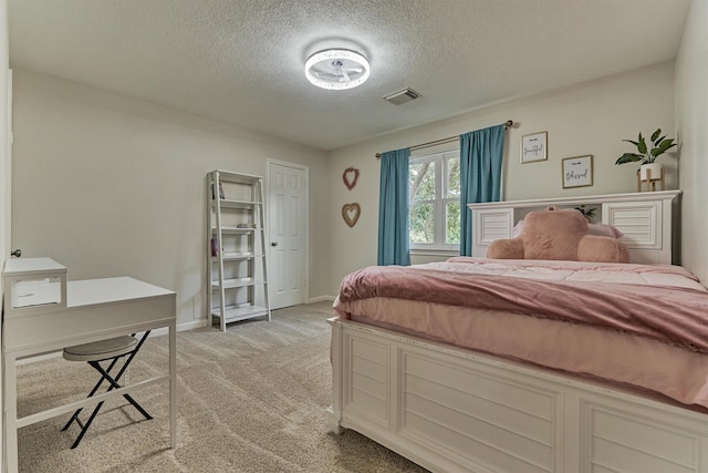 22811 Northampton Pines Dr, Spring, TX 77389 - bedroom with light carpet and a textured ceiling