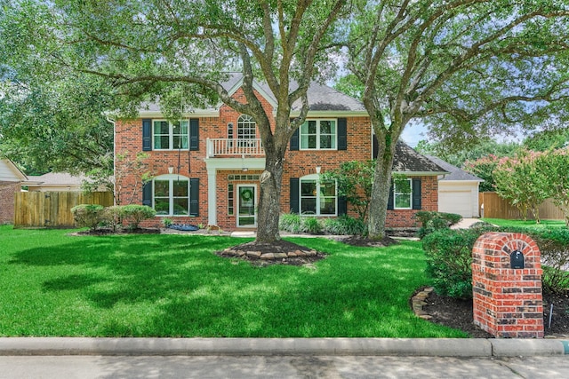 22811 Northampton Pines Dr, Spring, TX 77389 - colonial home with a balcony, brick siding, and a garage