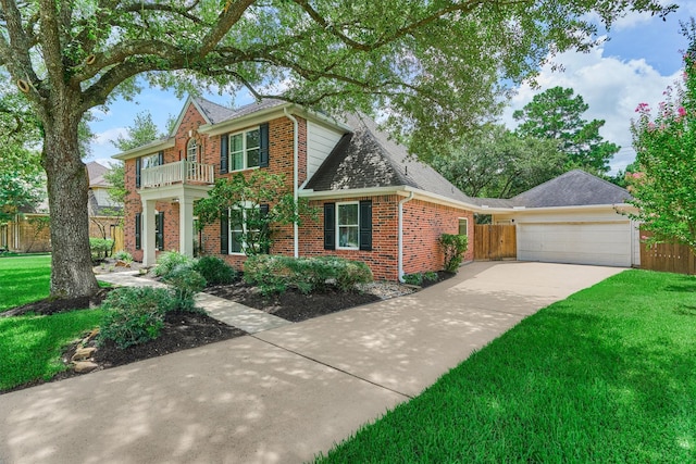22811 Northampton Pines Dr, Spring, TX 77389 - colonial inspired home featuring brick siding, a balcony, driveway, and a garage