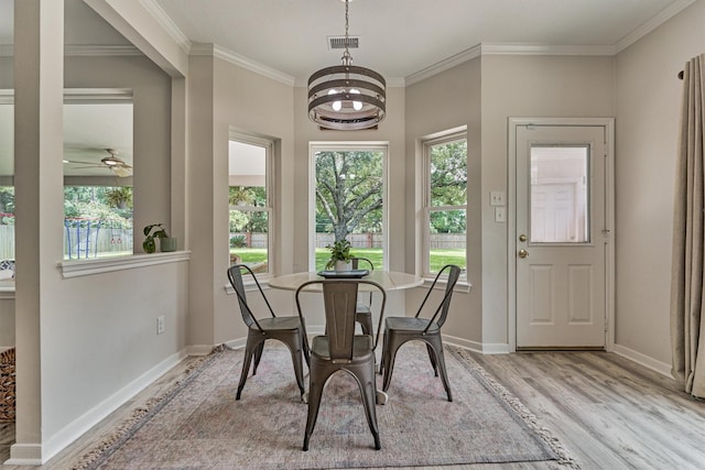 22811 Northampton Pines Dr, Spring, TX 77389 - dining space featuring ornamental molding, light wood-type flooring, and a ceiling fan