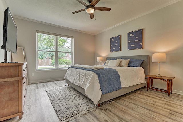 22811 Northampton Pines Dr, Spring, TX 77389 - bedroom with light wood-type flooring, crown molding, and a ceiling fan