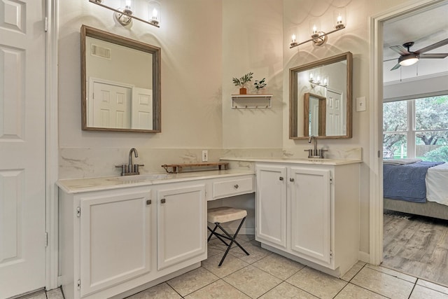 22811 Northampton Pines Dr, Spring, TX 77389 - ensuite bathroom with double vanity, ceiling fan, and tile patterned flooring