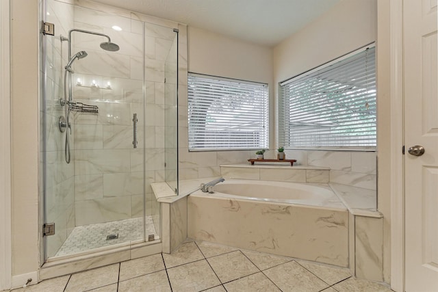 22811 Northampton Pines Dr, Spring, TX 77389 - full bathroom featuring a garden tub, a shower stall, and tile patterned floors