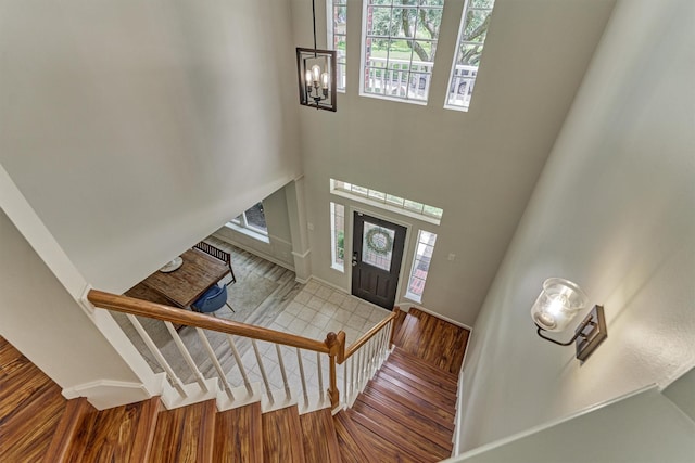22811 Northampton Pines Dr, Spring, TX 77389 - entryway featuring plenty of natural light, wood finished floors, a chandelier, and a towering ceiling