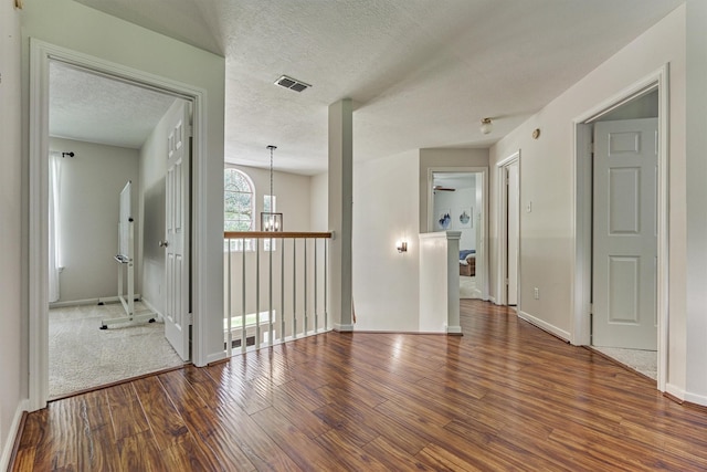 22811 Northampton Pines Dr, Spring, TX 77389 - empty room with wood finished floors and a textured ceiling