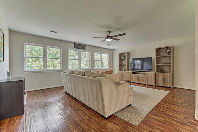 22811 Northampton Pines Dr, Spring, TX 77389 - living room featuring a ceiling fan and dark wood-style floors