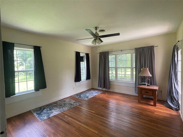 926 S Cass St, Centerville, TX 75833 - spare room featuring wood finished floors and a ceiling fan