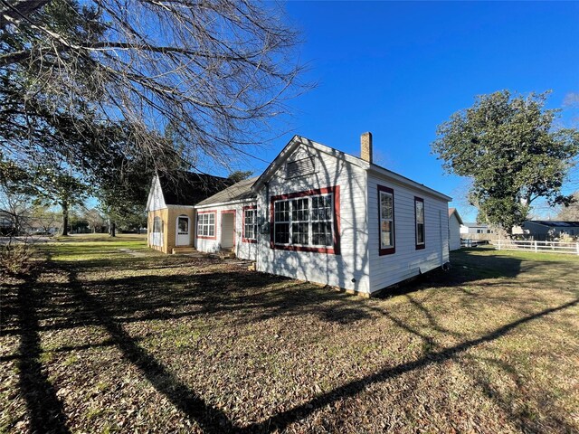 926 S Cass St, Centerville, TX 75833 - view of side of home with a chimney