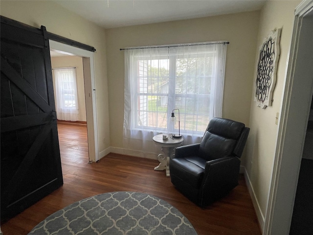 926 S Cass St, Centerville, TX 75833 - sitting room with wood finished floors and a barn door