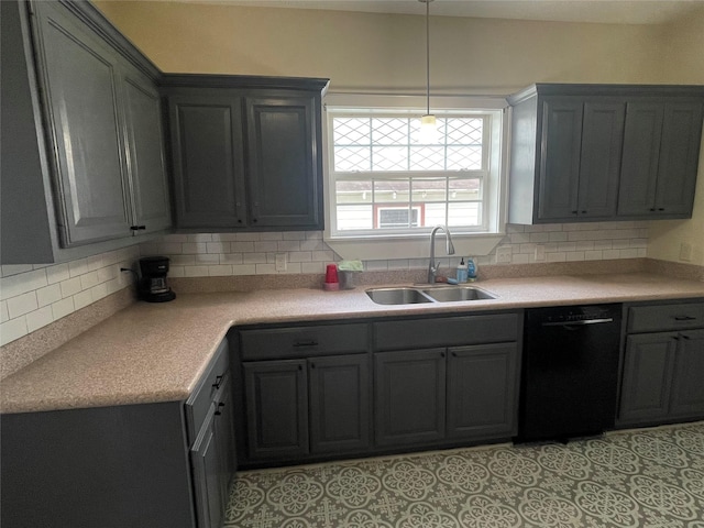926 S Cass St, Centerville, TX 75833 - kitchen featuring black dishwasher, decorative backsplash, light countertops, and pendant lighting