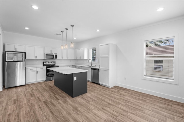 4358 Larkspur St, Houston, TX 77051 - kitchen featuring stainless steel appliances, plenty of natural light, a center island, light countertops, and recessed lighting