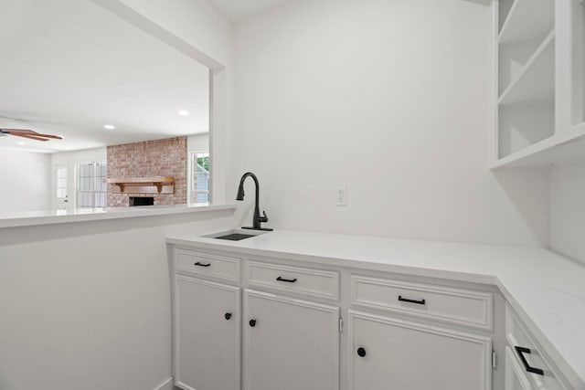 8215 Twining Oaks Ln, Spring, TX 77379 - bar with a brick fireplace, ceiling fan, and recessed lighting