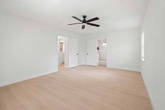 8215 Twining Oaks Ln, Spring, TX 77379 - unfurnished bedroom featuring light wood-style floors, ensuite bathroom, and ceiling fan
