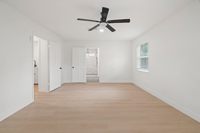 8215 Twining Oaks Ln, Spring, TX 77379 - empty room with a ceiling fan and light wood-style flooring