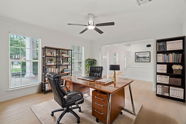 8215 Twining Oaks Ln, Spring, TX 77379 - home office with light wood finished floors, a ceiling fan, and ornamental molding