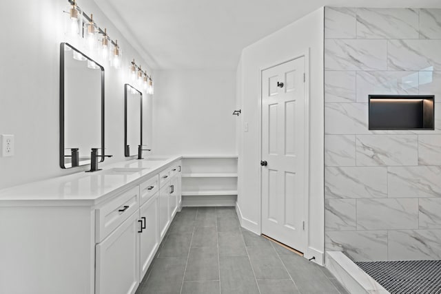8215 Twining Oaks Ln, Spring, TX 77379 - bathroom with double vanity, tiled shower, and tile patterned floors