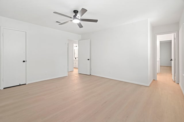 8215 Twining Oaks Ln, Spring, TX 77379 - unfurnished bedroom featuring light wood-style flooring and a ceiling fan