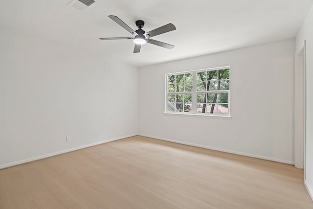 8215 Twining Oaks Ln, Spring, TX 77379 - unfurnished room featuring light wood-style floors and a ceiling fan