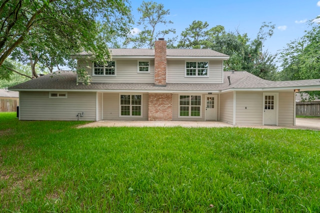 8215 Twining Oaks Ln, Spring, TX 77379 - rear view of house with a chimney, a patio area, and roof with shingles