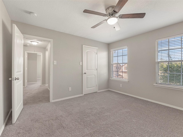 419 Eastern Phoebe, San Antonio, TX 78253 - unfurnished bedroom with carpet, ceiling fan, a textured ceiling, and attic access