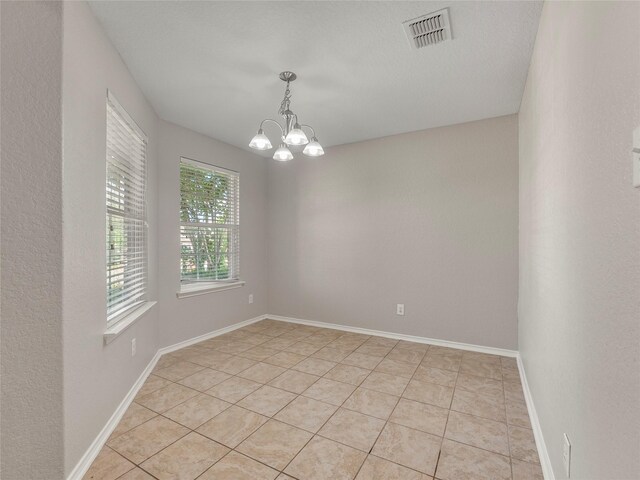 419 Eastern Phoebe, San Antonio, TX 78253 - spare room with a chandelier and light tile patterned floors