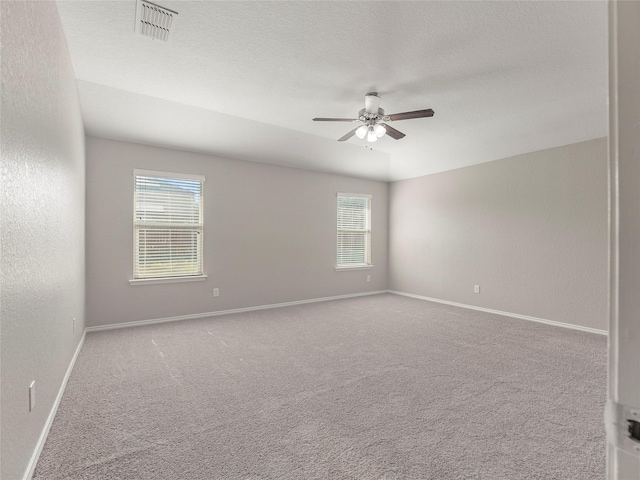 419 Eastern Phoebe, San Antonio, TX 78253 - spare room featuring a ceiling fan, carpet flooring, and healthy amount of natural light
