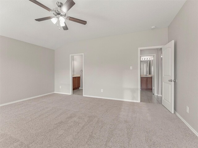 419 Eastern Phoebe, San Antonio, TX 78253 - unfurnished bedroom featuring light colored carpet, vaulted ceiling, ensuite bathroom, and a ceiling fan