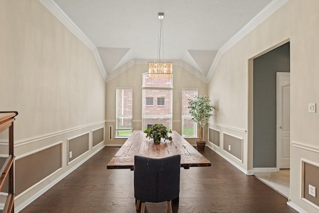 18114 Rustic Springs Dr, Tomball, TX 77375 - dining area featuring dark wood finished floors, a decorative wall, a chandelier, a wainscoted wall, and crown molding