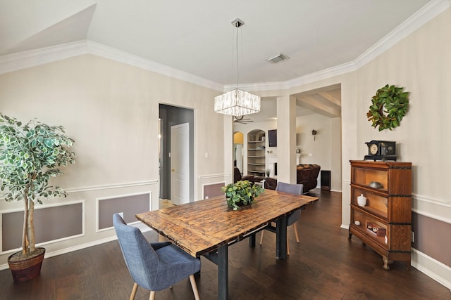 18114 Rustic Springs Dr, Tomball, TX 77375 - dining room featuring dark wood-style flooring, arched walkways, crown molding, and a chandelier