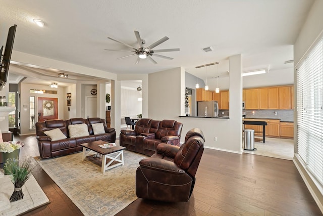 18114 Rustic Springs Dr, Tomball, TX 77375 - living area with ceiling fan and dark wood-style floors