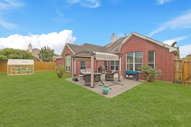 18114 Rustic Springs Dr, Tomball, TX 77375 - rear view of property featuring brick siding, a fenced backyard, and an exterior structure