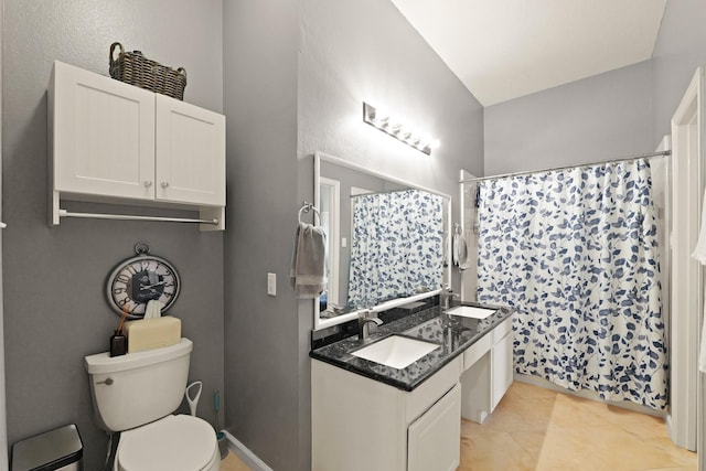 18114 Rustic Springs Dr, Tomball, TX 77375 - bathroom with double vanity, tile patterned flooring, and a shower with curtain