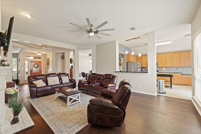 18114 Rustic Springs Dr, Tomball, TX 77375 - living area with ceiling fan and dark wood finished floors