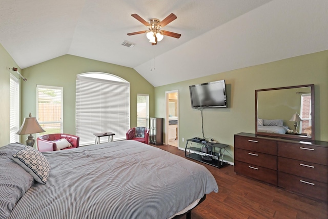 18114 Rustic Springs Dr, Tomball, TX 77375 - bedroom with dark wood-type flooring, lofted ceiling, a ceiling fan, and ensuite bathroom