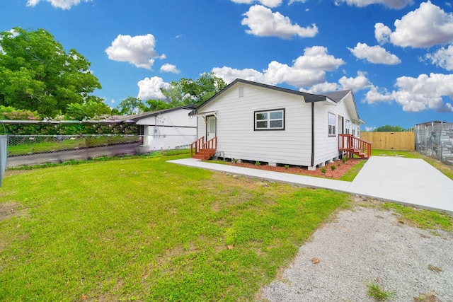 8318 Hanfro Ln, Houston, TX 77088 - rear view of house with entry steps and concrete driveway