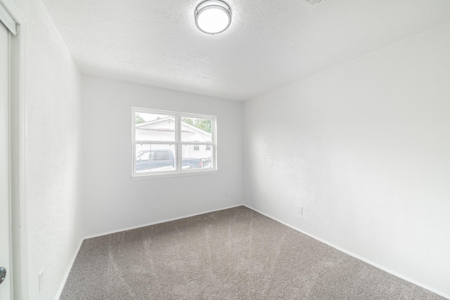 8318 Hanfro Ln, Houston, TX 77088 - spare room featuring carpet floors and a textured ceiling