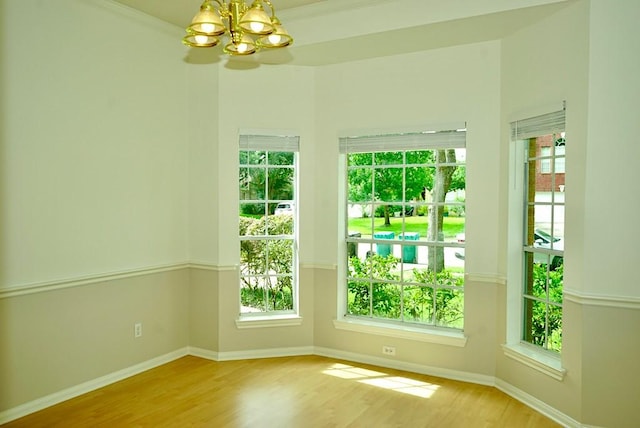 14811 Horse Creek Ln, Sugar Land, TX 77498 - unfurnished room with a chandelier and wood finished floors