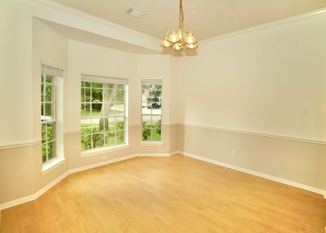 14811 Horse Creek Ln, Sugar Land, TX 77498 - unfurnished room with a chandelier, light wood-style floors, and crown molding