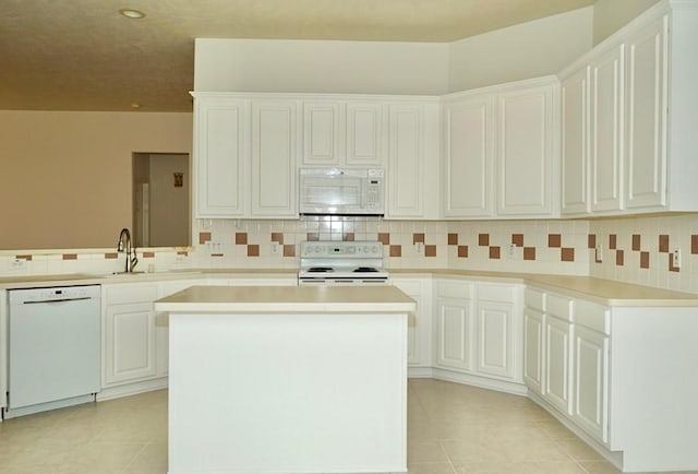 14811 Horse Creek Ln, Sugar Land, TX 77498 - kitchen with white appliances, light tile patterned flooring, decorative backsplash, and recessed lighting