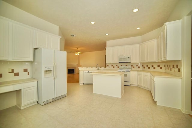 14811 Horse Creek Ln, Sugar Land, TX 77498 - kitchen featuring white appliances, ceiling fan, recessed lighting, tasteful backsplash, and light countertops