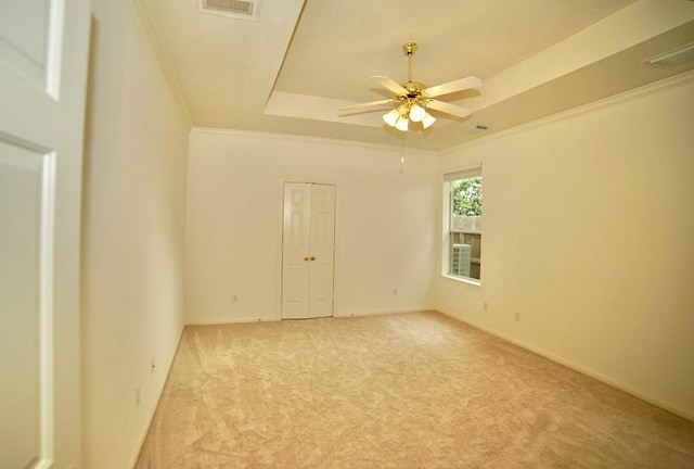 14811 Horse Creek Ln, Sugar Land, TX 77498 - carpeted empty room with a raised ceiling, a ceiling fan, and ornamental molding