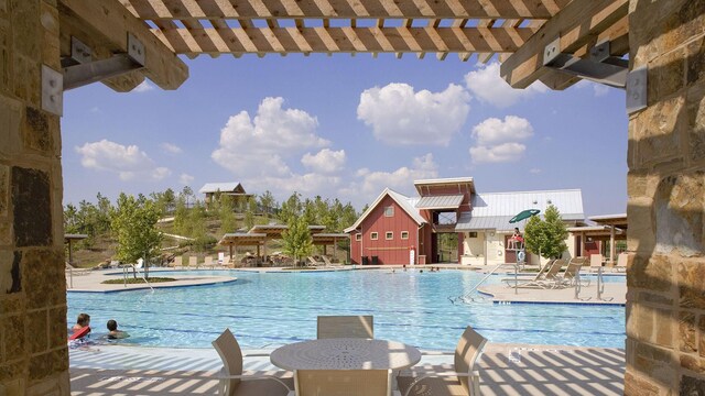 5603 Logan Ridge Ln, Fulshear, TX 77441 - community pool featuring a pergola