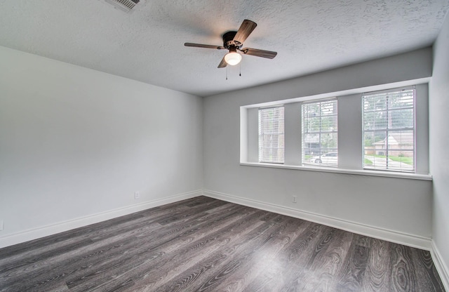 22710 Earlmist Dr, Spring, TX 77373 - unfurnished room with dark wood-type flooring, a textured ceiling, and a ceiling fan