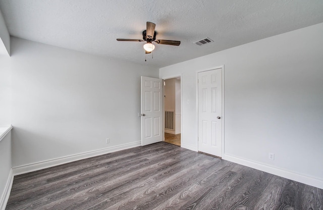 22710 Earlmist Dr, Spring, TX 77373 - unfurnished bedroom featuring wood finished floors, a textured ceiling, ceiling fan, and a closet