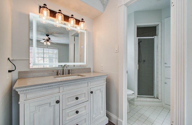 22710 Earlmist Dr, Spring, TX 77373 - bathroom featuring vanity, a shower stall, tile patterned floors, and a ceiling fan