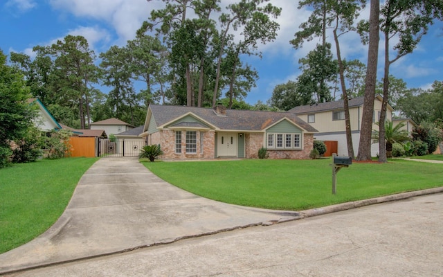 22710 Earlmist Dr, Spring, TX 77373 - view of front of property featuring a gate, a front lawn, a chimney, and brick siding
