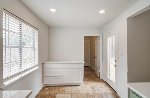 22710 Earlmist Dr, Spring, TX 77373 - entryway featuring plenty of natural light, stone finish floors, and recessed lighting