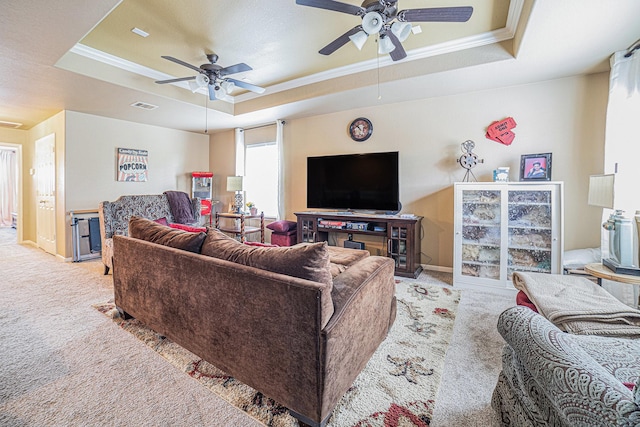 21530 Amesbury Meadow Ln, Spring, TX 77379 - living area with a tray ceiling, light colored carpet, a ceiling fan, and crown molding