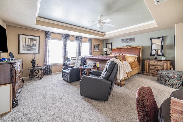21530 Amesbury Meadow Ln, Spring, TX 77379 - carpeted bedroom featuring a tray ceiling, a ceiling fan, and crown molding